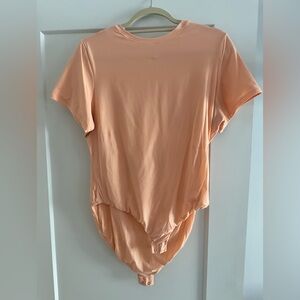 SKIMS T-Shirt Bodysuit in Faded Nectar